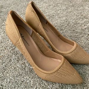 Neiman Marcus brand pumps. Never been worn. Nude/Beige